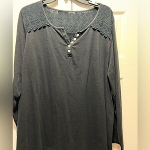 Black long sleeve, shirt with 5 buttoned front.